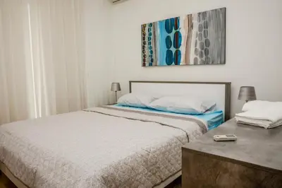 a bedroom with a large bed and a table at Seaway moments in Limassol