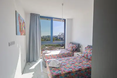 a living room with a couch and a window at Protaras Aqua Pearl Villa AQ12 in Paralimni