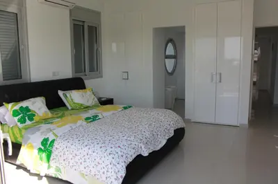 a bedroom with a bed and a mirror at Marymina Villa in Protaras