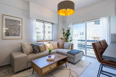a living room with a couch and a table at Elegant City Central Suite in Nicosia