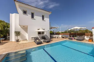 a villa with a swimming pool and a house at Villa Protaras View 9 Central Protaras -Fig Tree Bay-Jacuzzi-Hot Tub in Protaras