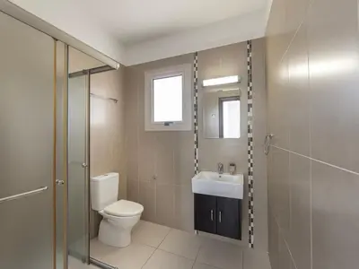 a bathroom with a toilet and a sink and a shower at villa Sama palms 21 in Protaras