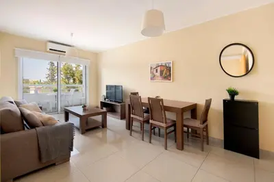 a living room with a table and a couch at City Center, Nice View, 2BR in Larnaka