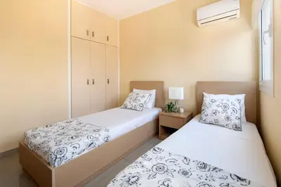 two beds in a small bedroom with aermottermottermottermott at City Center, Nice View, 2BR in Larnaka