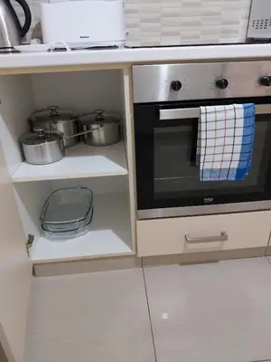 a kitchen with a stove and some pots and pans at City Center, Nice View, 2BR in Larnaka