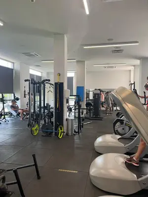 a gym with people exercising on treadmills and machines at Mythical Sands Resort, Protaras, Choose Joy Apt in Paralimni
