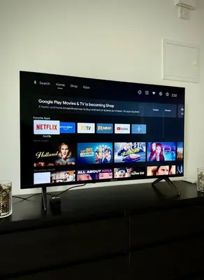 a flat screen tv sitting on top of a dresser at Limassol Star Complex Seaview Apartment in Limassol