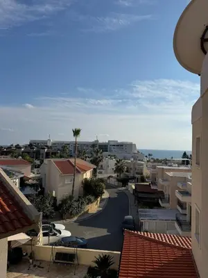 a view of a city with buildings and the ocean at Limassol Star Complex Seaview Apartment in Limassol