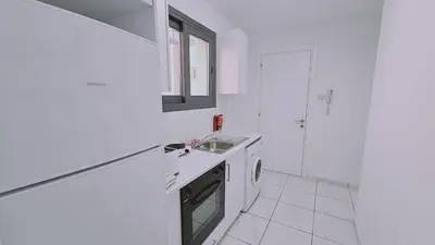 a white kitchen with a sink and a window at STAY Cypress Studio in Limassol