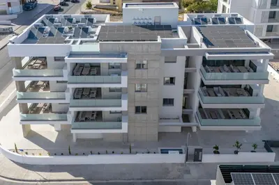 an aerial view of a building with solar panels on it at Mulberry Court Premium Apartments in Limassol