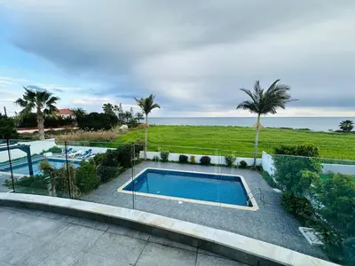 a swimming pool with a view of the ocean at Villa Eva in Mazotos