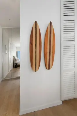 two surfboards on display on a wall in a room at Luxury Beachfront Apartment in Limassol