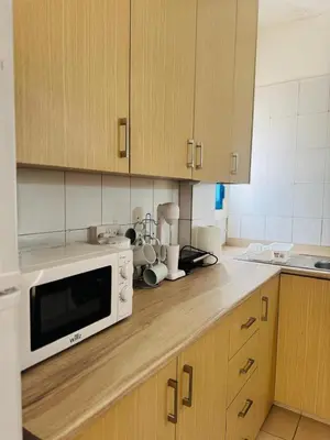 a kitchen with a white microwave on a counter at Marielenas in Larnaka