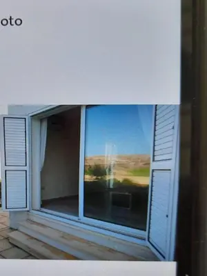 a large window with a view of a room at Beautiful 1-Bed House in Aglantzia
