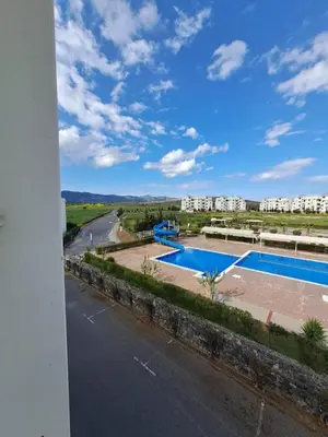 a view from the balcony of a apartment with a swimming pool at Beautiful 1-Bed House in Aglantzia