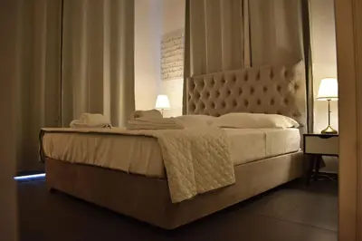 a bedroom with a large bed with towels on it at Mythical Sands - Saltos in Paralimni