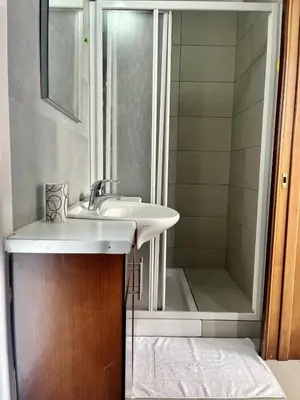 a bathroom with a sink and a shower at Luxury Villa Azure in Larnaka