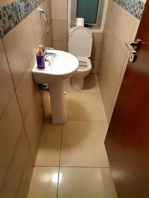 a bathroom with a sink and a toilet at Luxury Villa Azure in Larnaka