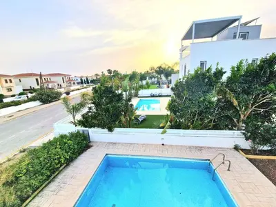 a swimming pool in front of a house at Luxury Villa Azure in Larnaka