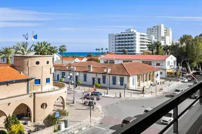 a view of a city with a street and buildings at Finikoudes Marina View 202 in Larnaka
