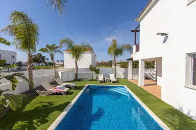 a swimming pool in the backyard of a house at Sweet Seaview Villa in Ayia Napa