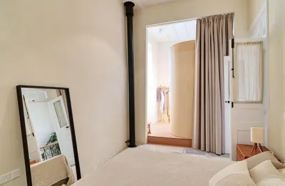 a bedroom with a mirror and a bed at Timeless Gem in Old Nicosia in Nicosia