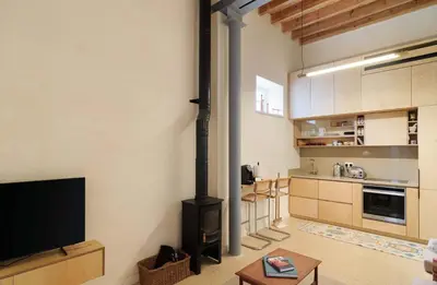 a living room with a black stove in a kitchen at Timeless Gem in Old Nicosia in Nicosia