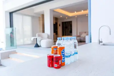 a group of bottles of milk sitting on a counter at Deluxe Seafront - 2 Bed in Limassol