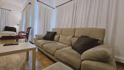 a living room with a couch and a table at STAY Aurum Apartment in Nicosia