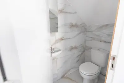 a white bathroom with a toilet and a sink at Mandali Villa 20 - Fully Renovated Villa in Paralimni