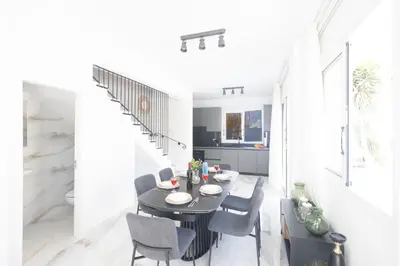 a dining room with a table and chairs at Mandali Villa 20 - Fully Renovated Villa in Paralimni