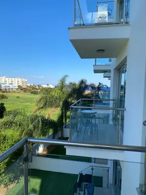 a balcony of a house with a table and chairs at Apartment Lorena Protaras in Protaras