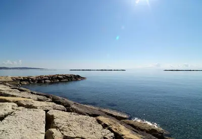 a view of a body of water with rocks at Beach Walk - Central, Cool, Cute, Convenient in Limassol