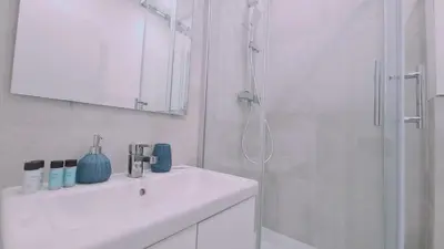 a white bathroom with a sink and a shower at STAY Napa Oasis Studio in Ayia Napa