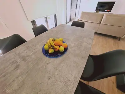 a plate of fruit on a table in a room at Limassolian vibe house in Limassol