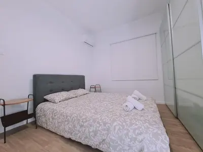 a bedroom with a bed with two white towels on it at Limassolian vibe house in Limassol