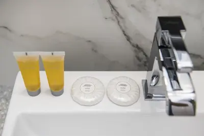 a counter with two glasses of beer and a mixer at STAY Urban Skin Suite in Nicosia