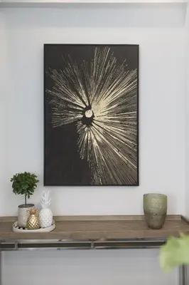 a picture hanging on a wall above a shelf at STAY Urban Skin Suite in Nicosia