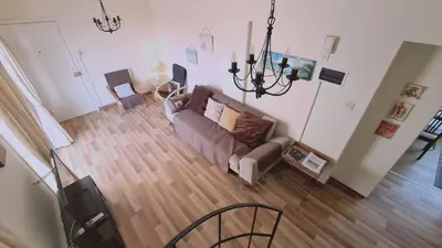 an overhead view of a living room with a couch at STAY Sea and Salt Lake Panoramic View Apt in Larnaka