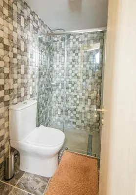 a bathroom with a toilet and a shower at Marisa Napa Suites Ayia Napa in Ayia Napa