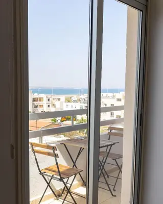 a view of a balcony with a table and chairs at Stunning apartment with sea view in Larnaka