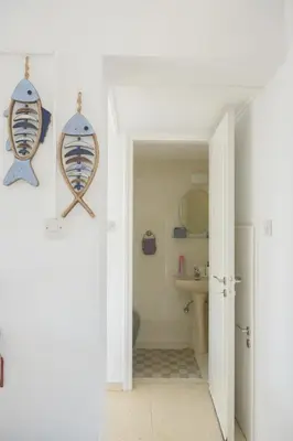 a bathroom with a toilet and a sink at Cavo Greco Oasis in Protaras