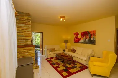 a living room with two couches and a table at Amazing Villa in Pano Platres Cyprus in Kato Platres