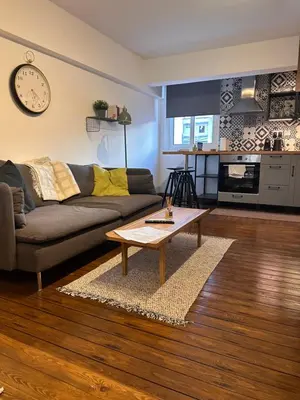 a living room with a couch and a coffee table at Cozzi Deluxe Studio in Voroklini