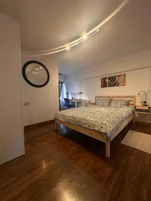 a bedroom with a large bed in a room at Cozzi Deluxe Studio in Voroklini