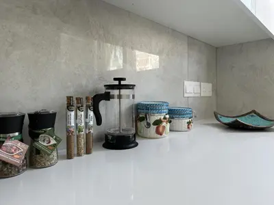 a kitchen counter with a coffee maker on a shelf at Modern Seaside Retreat Near Nissi Beach in Ayia Napa