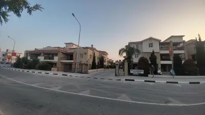 an empty street with houses on the side of the road at Pyla Gardens A104 in Pyla
