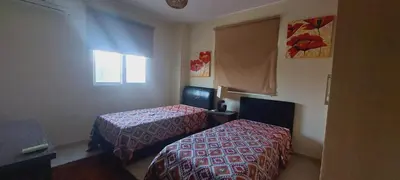 a hotel room with two beds and a window at Pyla Gardens A104 in Pyla