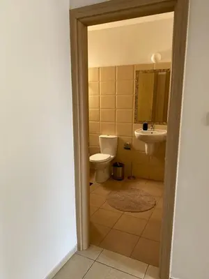 a bathroom with a toilet and a sink at Pyla Village Resort E108 in Pyla