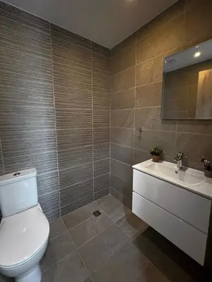 a bathroom with a toilet and a sink at Rachel 401 in Larnaka